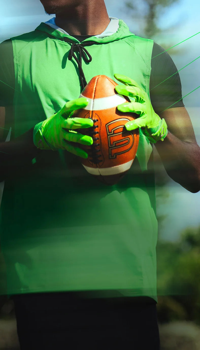 Cutters - Leaders In Football Grip Performance (Image Showcasing Football Athlete Wearing Rev Pro 6.0 Shock Green Receiver Football Gloves)