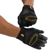 Cutters Rev X Elite Receiver Football Gloves - Black/Gold - Football Player Pulling Glove Over Wrist for Better Fit