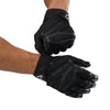 Cutters Sports Rev Pro 6.0 Solid Receiver Football Gloves - Black - Football Player Pulling Glove Over Wrist for Better Fit