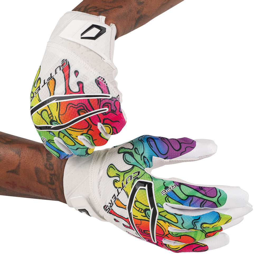 Cutters Sports Rev Pro 6.0 LE Receiver Football Gloves - Multi Drip - Football Player Pulling Glove Over Wrist for Better Fit