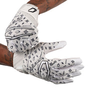 Cutters Sports Rev Pro 6.0 LE Receiver Football Gloves - White/Black Lux - Football Player Pulling Glove Over Wrist for Better Fit