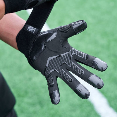 Cutters Sports Force 5.0 Black Lineman Football Gloves - Lifestyle Image 3 -  Detail View of Palm and Strap (Tightened Around Players Wrist)