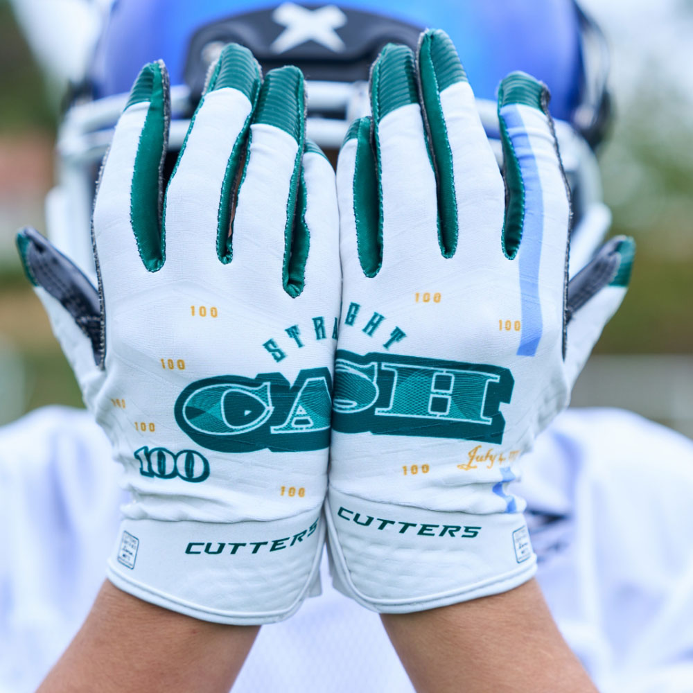 Lifestyle Image of Youth Football Player Wearing Straight Cash Rev 5.0 Limited-Edition Youth Receiver Gloves