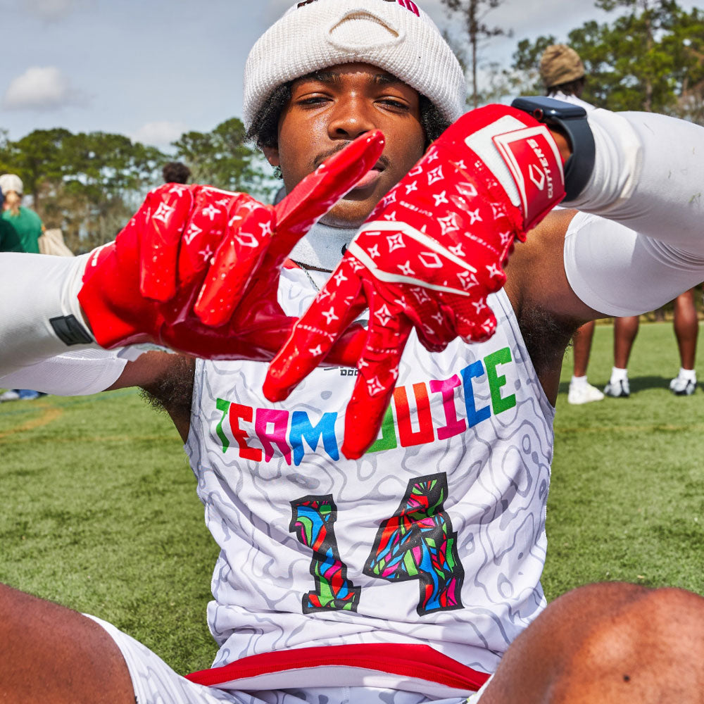Youth 7v7 Football Player Wearing Red/White Lux Rev Pro 5.0 Limited-Edition Receiver Gloves