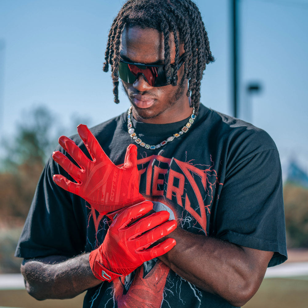 Marvin Harrison Jr. - NFL Wide Receiver for the Arizona Cardinals - Wearing Rev Pro 6.0 Football Receiver Gloves in Red