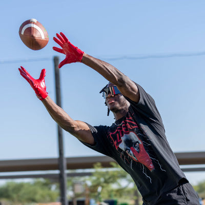 Marvin Harrison Jr. - NFL Wide Receiver for the Arizona Cardinals - Wearing Rev Pro 6.0 Football Receiver Gloves in Red (Going to Catch Football)