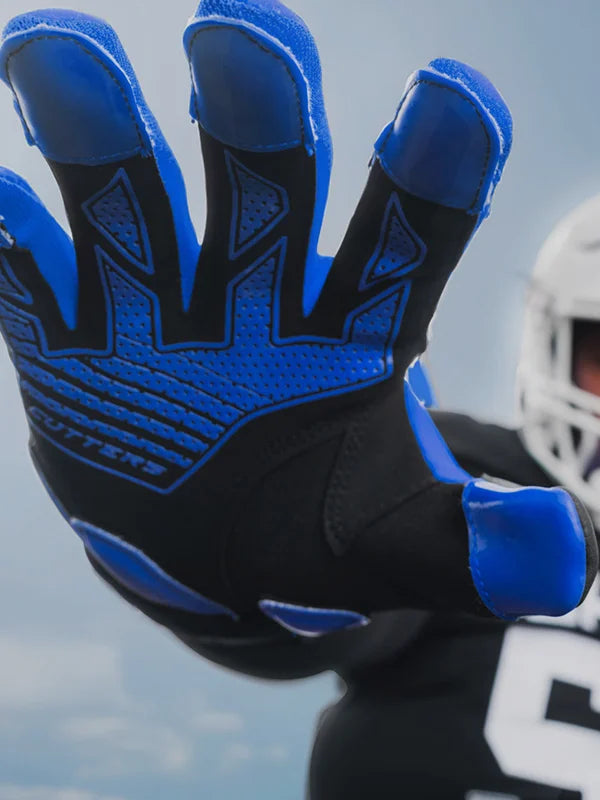 Youth Football Athlete Wearing Force 6.0 Lineman Gloves in Royal Blue