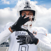 Athlete Wearing Cutters Rev Pro 6.0 Limited Edition Football Receiver Gloves in Black/White Lux Print
