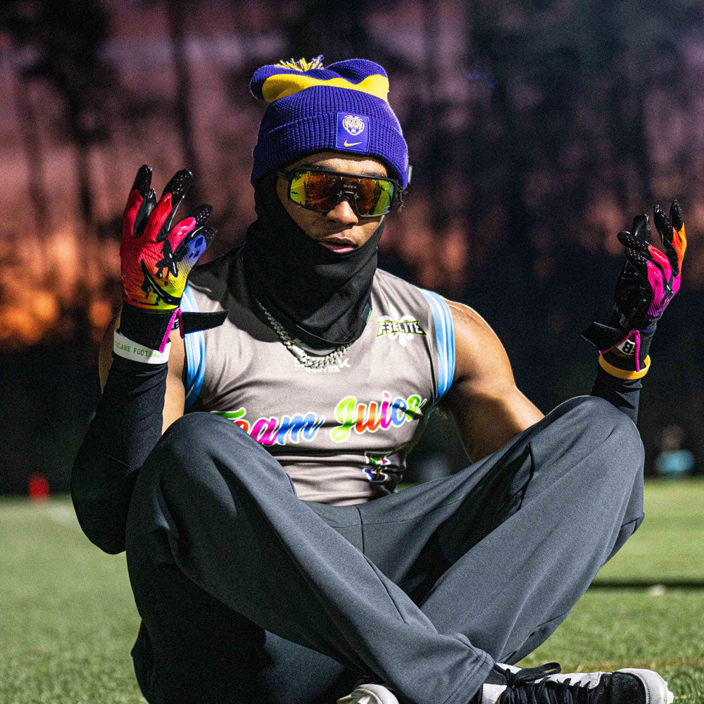 Lifestyle Image of Youth Football 7v7 Player Wearing Cutters Drip Face Rev Pro 5.0 Limited-Edition Receiver Gloves