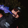 Youth 7v7 Football Player Wearing Cutters Rev Pro 6.0 Solid Receiver Gloves in Purple