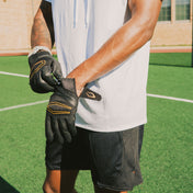 Aaron Butler Pulling Cutters Rev X Elite Black/Gold Receiver Football Gloves Over Wrist for Better Fit