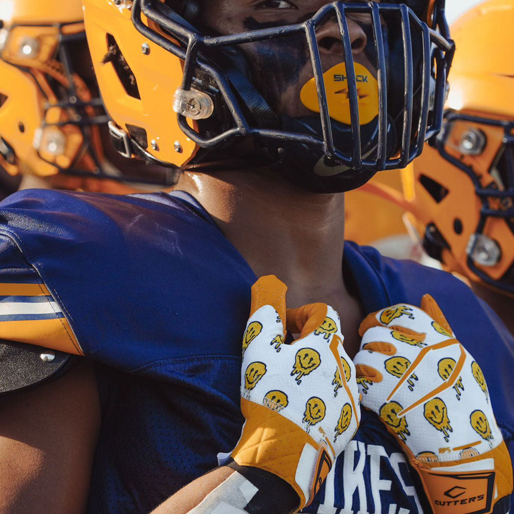Tackle Football Player Wearing Cutters Smile Rev Pro 5.0 Limited-Edition Receiver Gloves