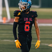 High School Football Player Wearing Cutters Rev Pro 5.0 Solid Receiver Gloves in Gold/Yellow Color