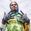 Youth Football Player Wearing Cutters Sports Black Lux Rev Pro 4.0 Limited Edition Receiver Gloves