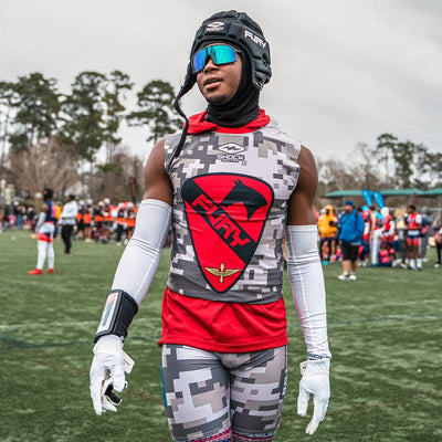 Youth Football Player Wearing Cutters Sports White Rev Pro 5.0 Receiver Gloves