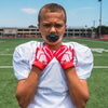 Youth Football Player Wearing Cutters Sports Red Rev 4.0 Receiver Gloves