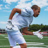 Youth Football Player Wearing Cutters Sports White Rev 4.0 Receiver Gloves