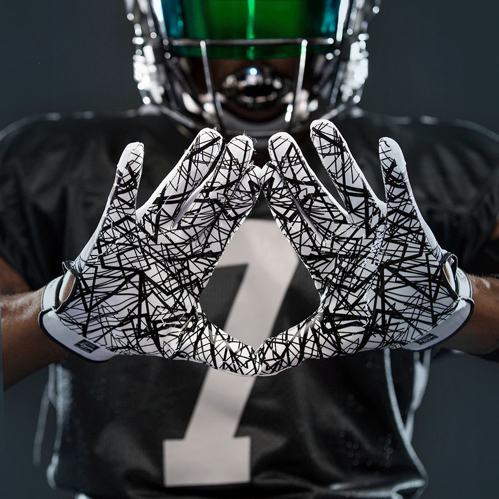 Football Player Showcasing Cutters Sports Black Game Day Receiver Football Gloves - C-TACK Grip